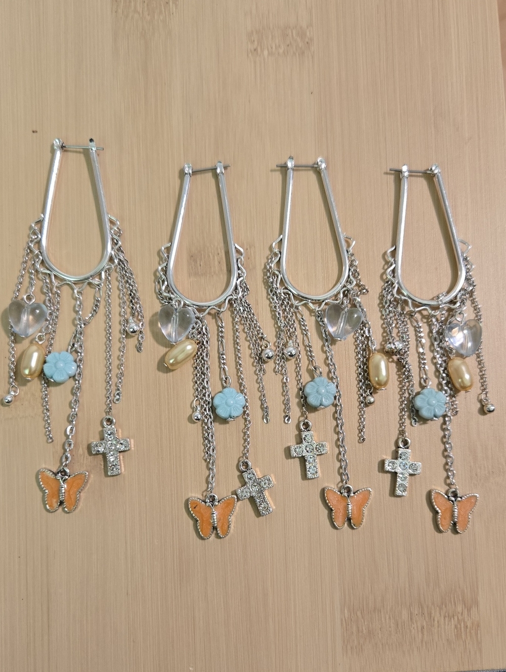 Two pairs of silver-tone earrings